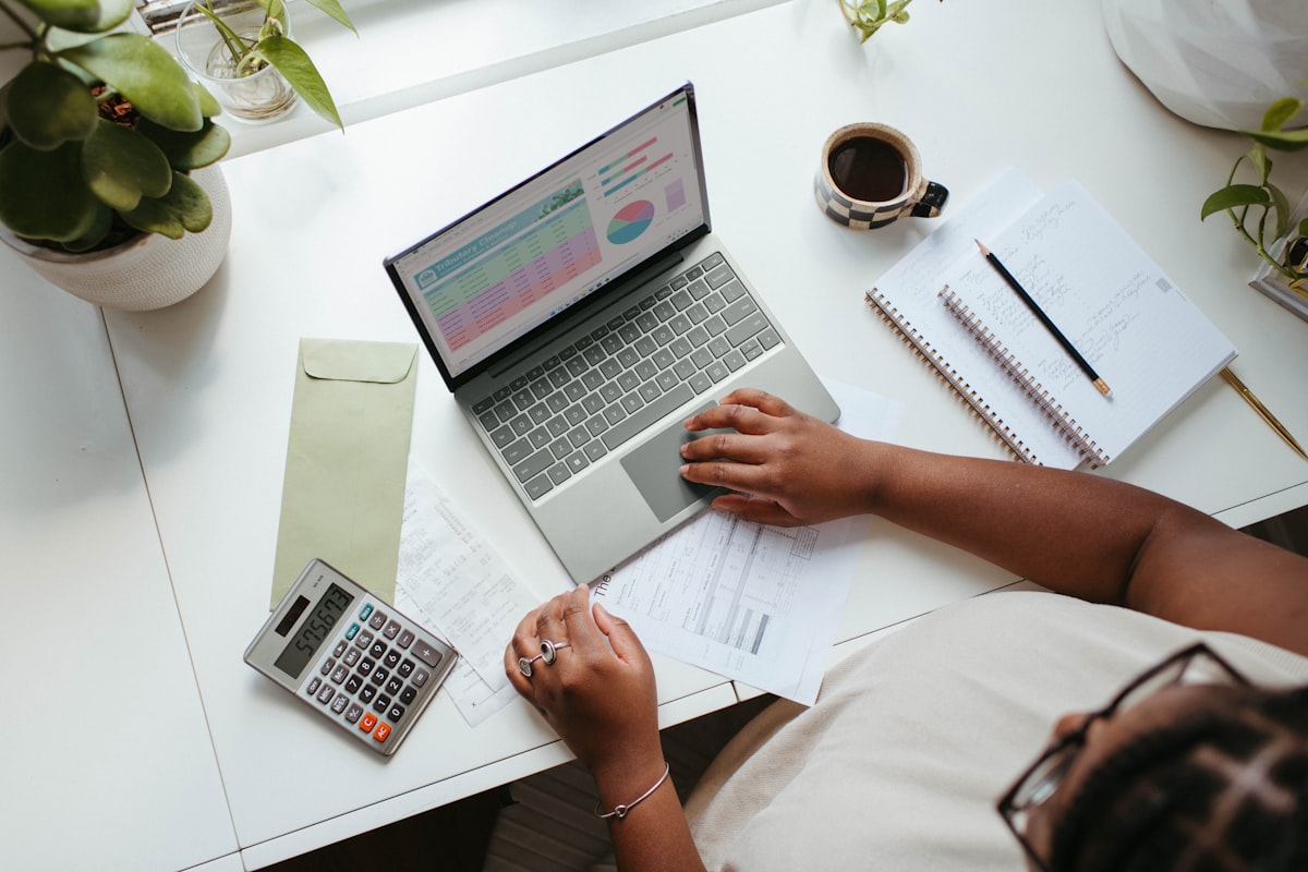 Person managing finances on a laptop